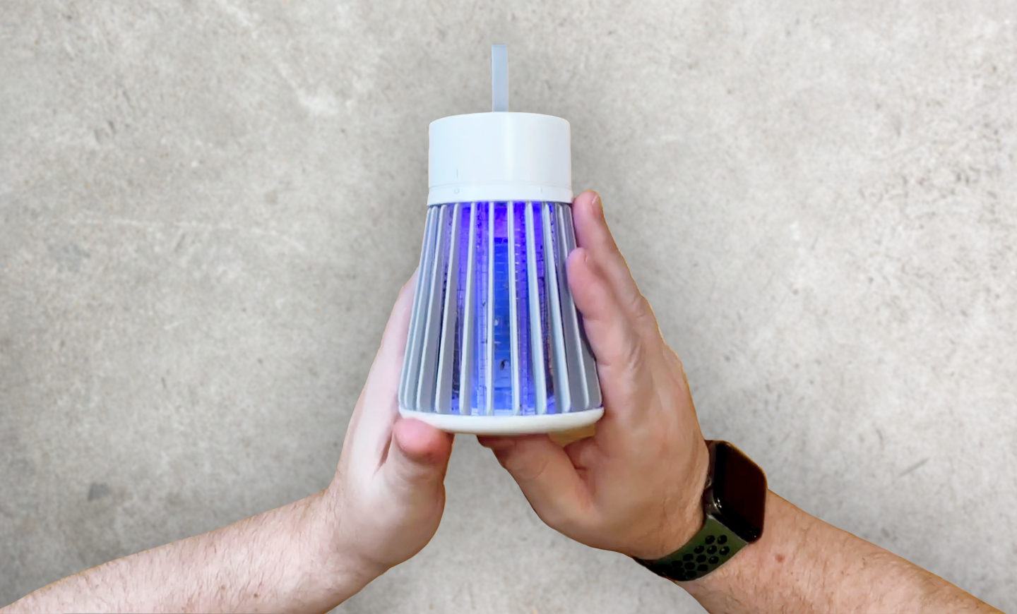 SimplyZap Mosquito Lamp held in hand showing the blue UV light grille