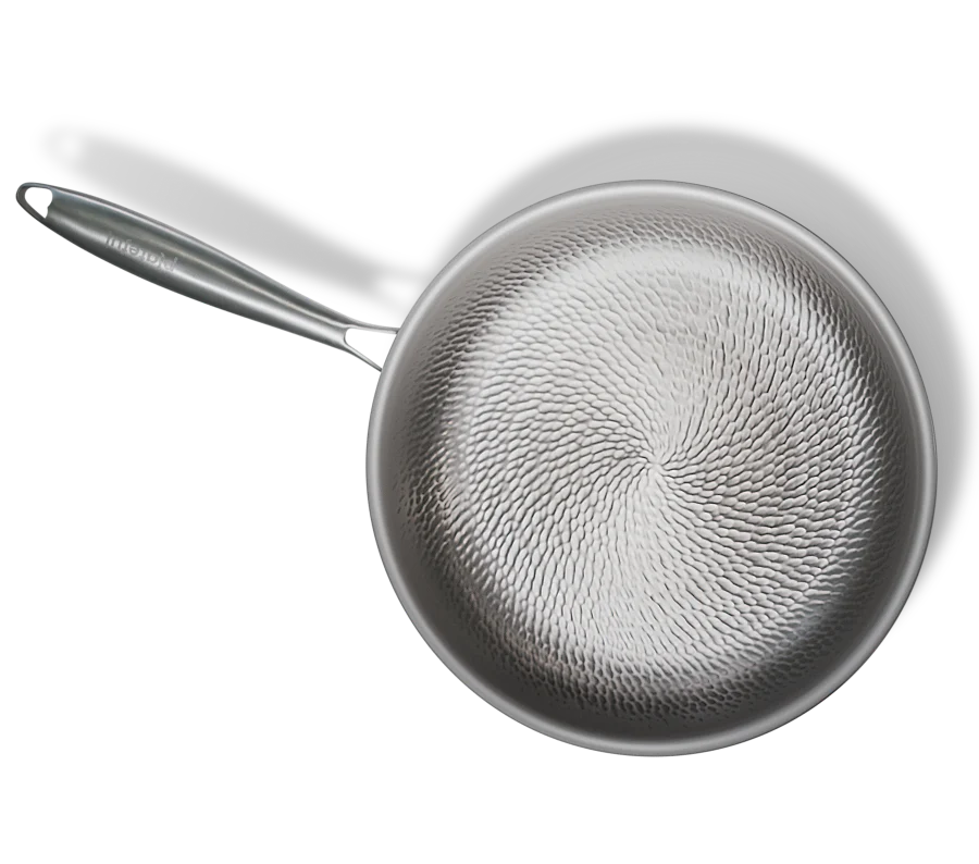 Top-down view of Titanium Pro Pan™ hammered cooking surface and stainless steel handle
