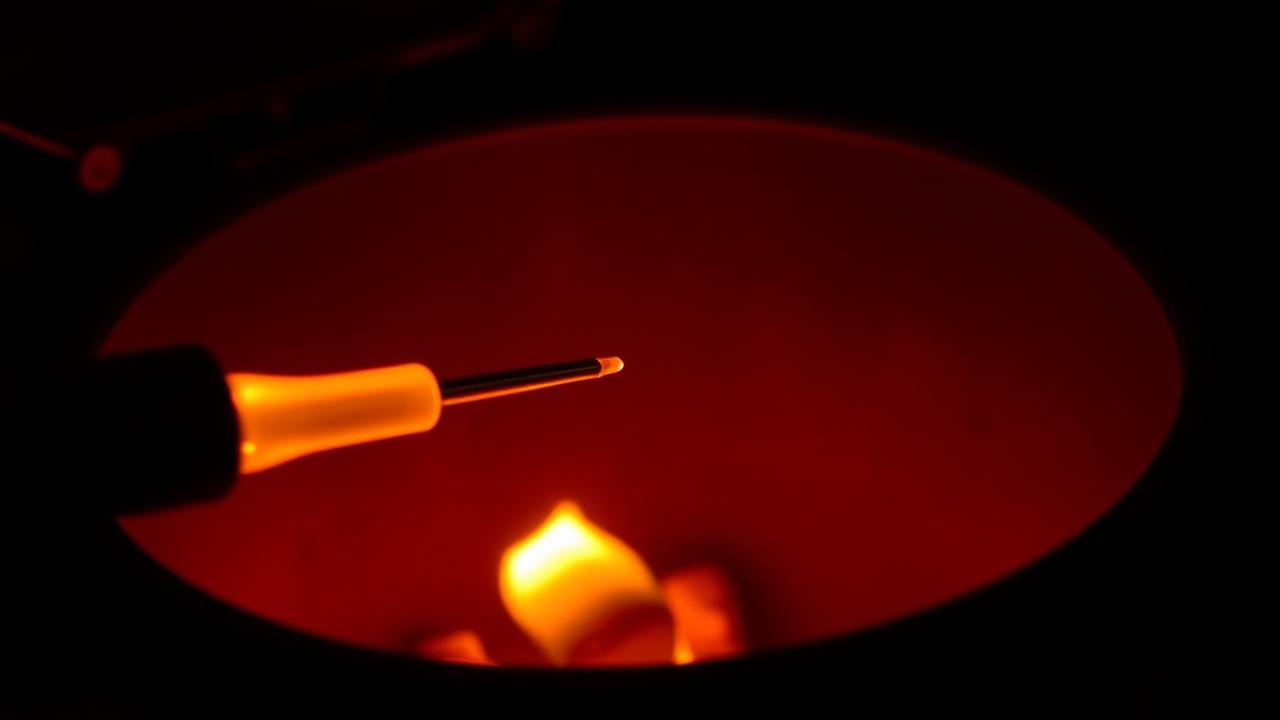 Traeger hot rod glowing inside fire pot during ignition